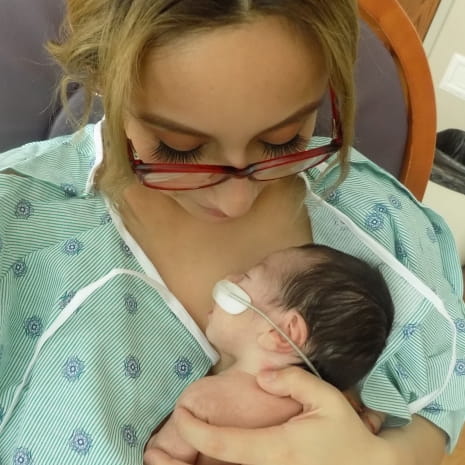 Skin to skin contact - Mother holding baby