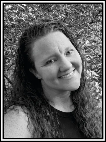 A portrait of Charlotte in black and white