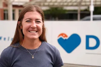 Cardiology patient Molly Onders in front of Denver Health
