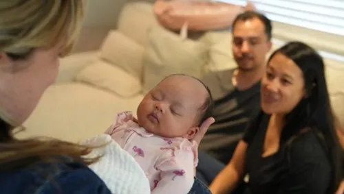 newborn baby being held