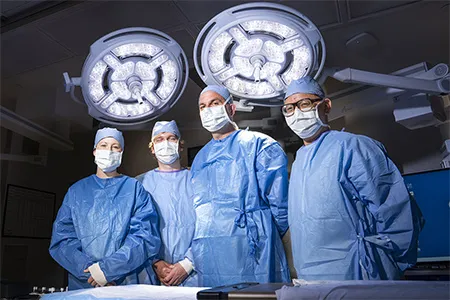 Fredric M. Pieracci, MD, MPH, chair of surgery (second from right), and Dante Yeh, MD, medical director of emergency general surgery (right), helped to lead our health system to this milestone.