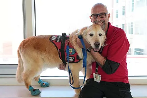 Golden retriever Remy and his owner, Eric Hoff